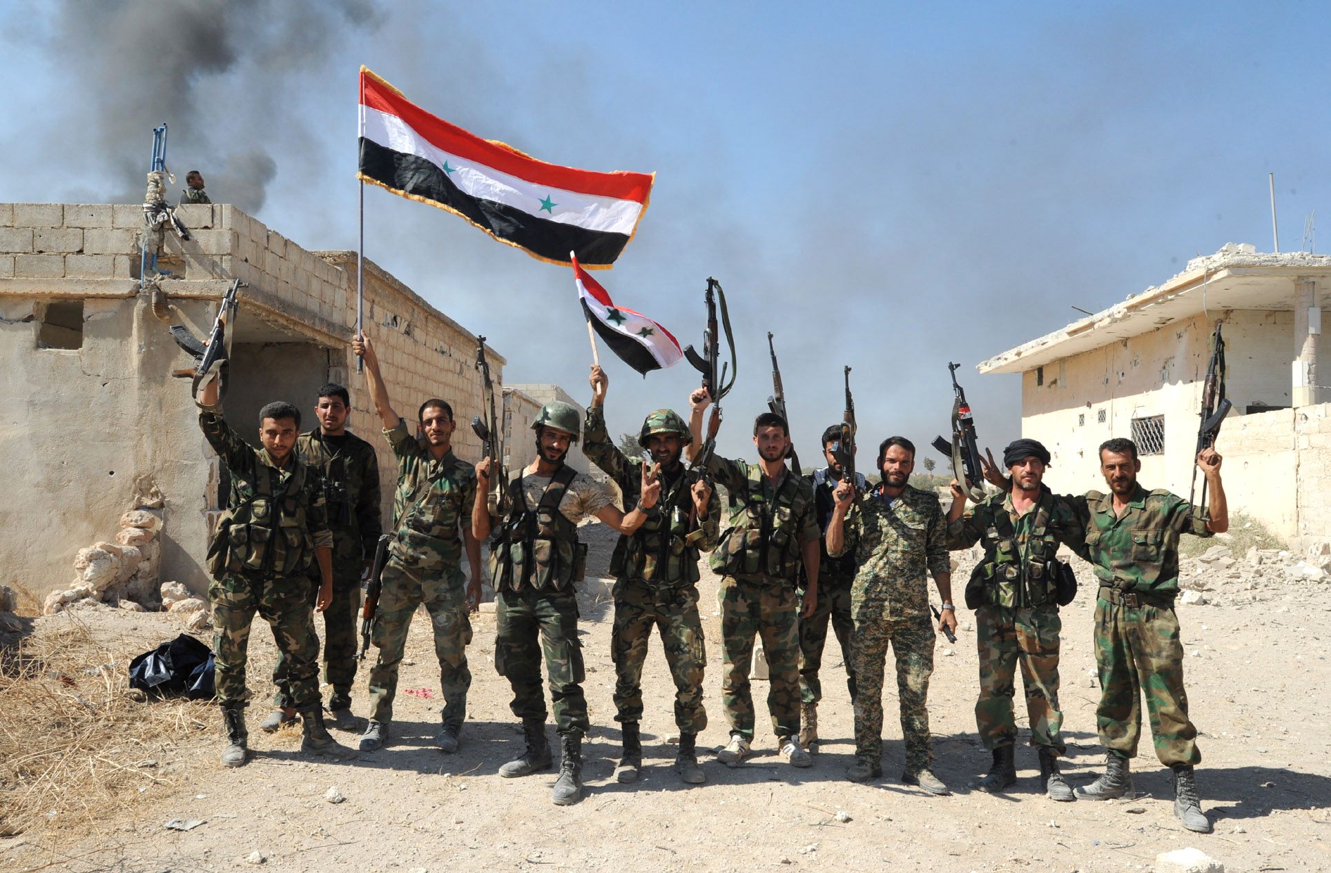 A handout picture released by the official Syrian Arab News Agency (SANA), shows Syrian army units and pro-government forces deploying at an undisclosed location in the Atshan village in central province of Hama, on October 11, 2015. Regime forces advanced in the central Syrian province of Hama against armed opposition groups in a ground operation backed by Russian air strikes. AFP PHOTO / HO / SANA
=== RESTRICTED TO EDITORIAL USE - MANDATORY CREDIT "AFP PHOTO / HO / SANA" === NO MARKETING NO ADVERTISING CAMPAIGNS - DISTRIBUTED AS A SERVICE TO CLIENTS ===