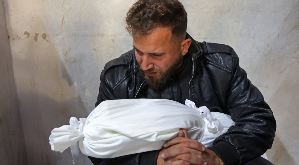 Padre palestino y su hija muerta