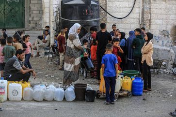 KHAN YUNIS, GAZA - JUNE 28: Palestinians try to meet their daily water needs by filling jerry cans from water tankers brought into the area in Khan Yunis, Gaza on June 28, 2025. In the Gaza Strip, which remains under Israeli attacks, Palestinians are struggling to survive under extremely harsh conditions, deprived of even the most basic necessities such as shelter, food, and clean water. (Photo by Abed Rahim Khatib/Anadolu via Getty Images)